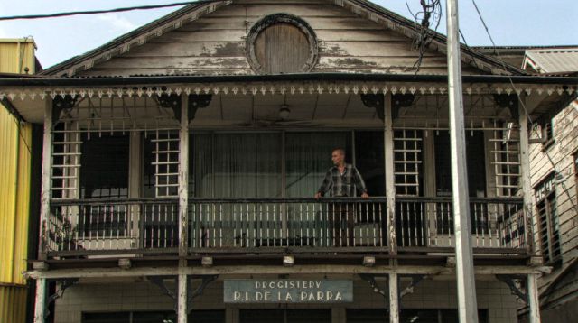 Figure 1. Pim de la Parra on the upper veranda of his childhood home in Paramaribo, Suriname. He lived here from age seven to twenty with his father, brother and five aunties. De la Parra used to have his bedroom on the first floor whilst the ground floor functioned as his father’s pharmacy. ‘My father was very busy earning money to maintain our household. He ran a pharmacy and was a wholesaler of medicines.’ Photo by: In-Soo Productions / Fu Works.